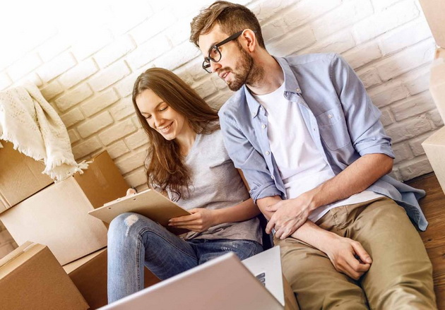 Chilling couple preparing for house moving
